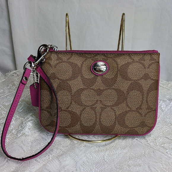 Coach Handbags - Coach Tan & Pink Coated Canvas Wristlet With Pink Hangtag, Signature Print Cs